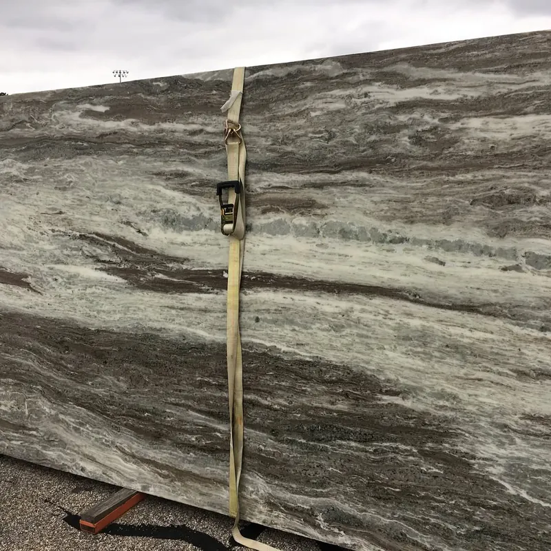 Slab in sweeping bands of brown, gray and white, strapped on the rack at 18 Fruean Way