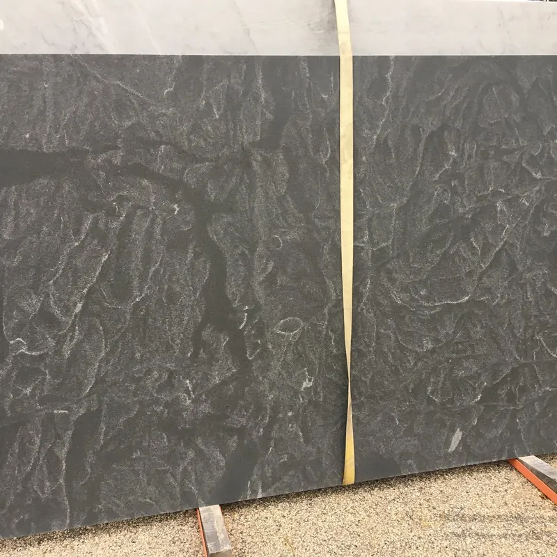 Charcoal slab with a rippled, leathered surface in the yard at 18 Fruean Way